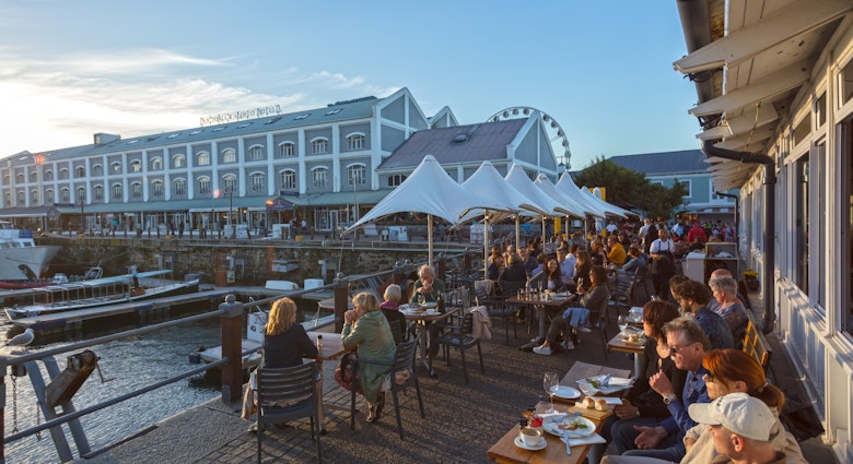 People Enjoying Beautiful Sunset in Restaurant. Waterfront -Cape Town ,South Africa 11-11-2017, License Type: media, Download Time: 2024-08-30T14:45:46.000Z, User: bfreeman_lonelyplanet, Editorial: true, purchase_order: 65050, job: Online Editorial, client: Things to know South Africa, other: Bailey Freeman