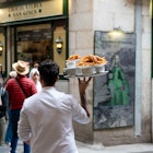 APRIL 29, 2024: Chocolatería San Ginés is a popular restaurant in Madrid for churros and chocolate. It's been servicing customers since 1894. Here, waiters prepare and bring diners their churros.
Spain Marketing 1379722